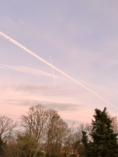 Sky with crossing contrails