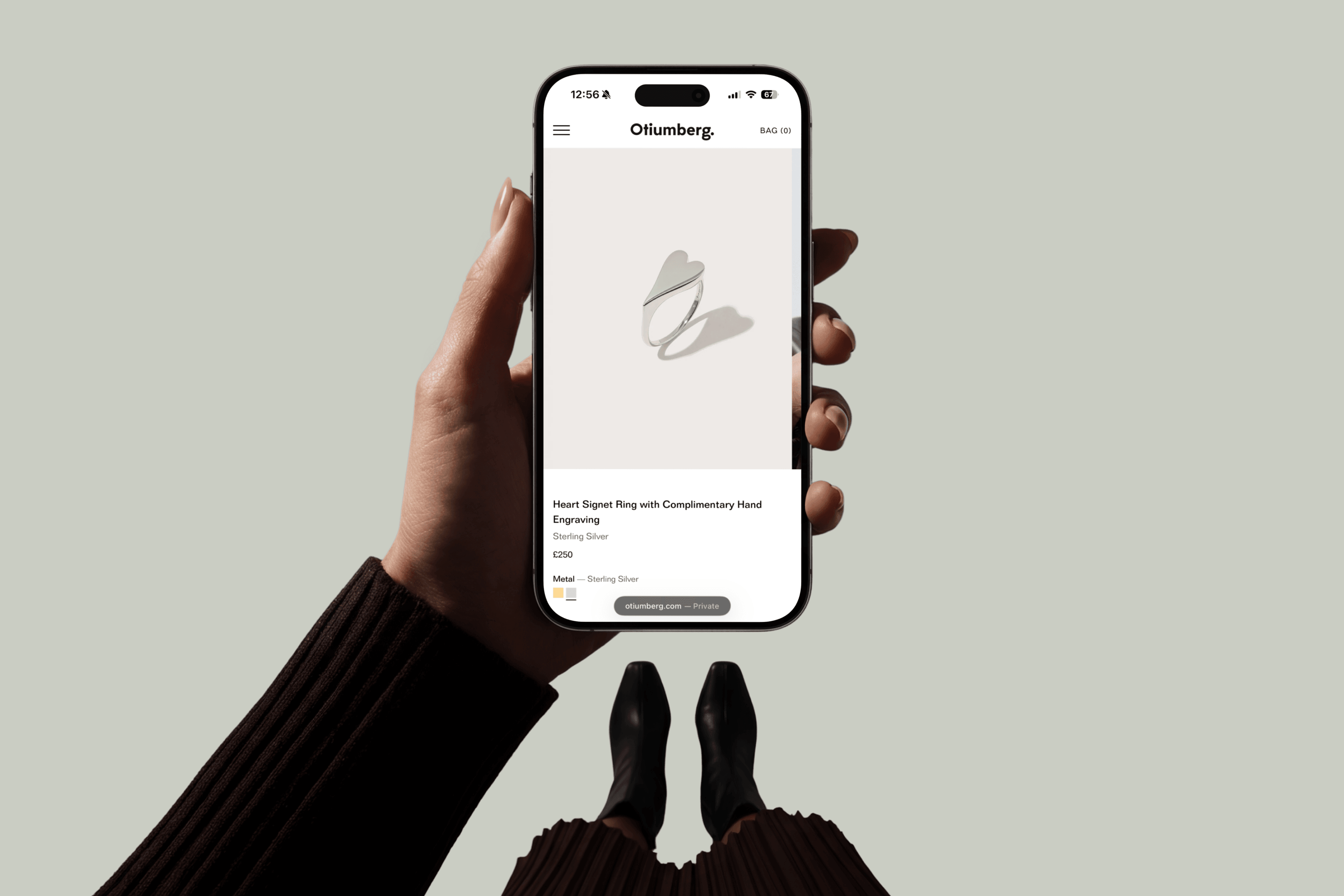 Otiumberg mobile experience held in hand
