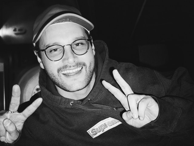 Ollie smiling in a cap